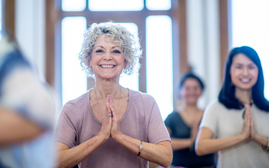 older woman doing yoga