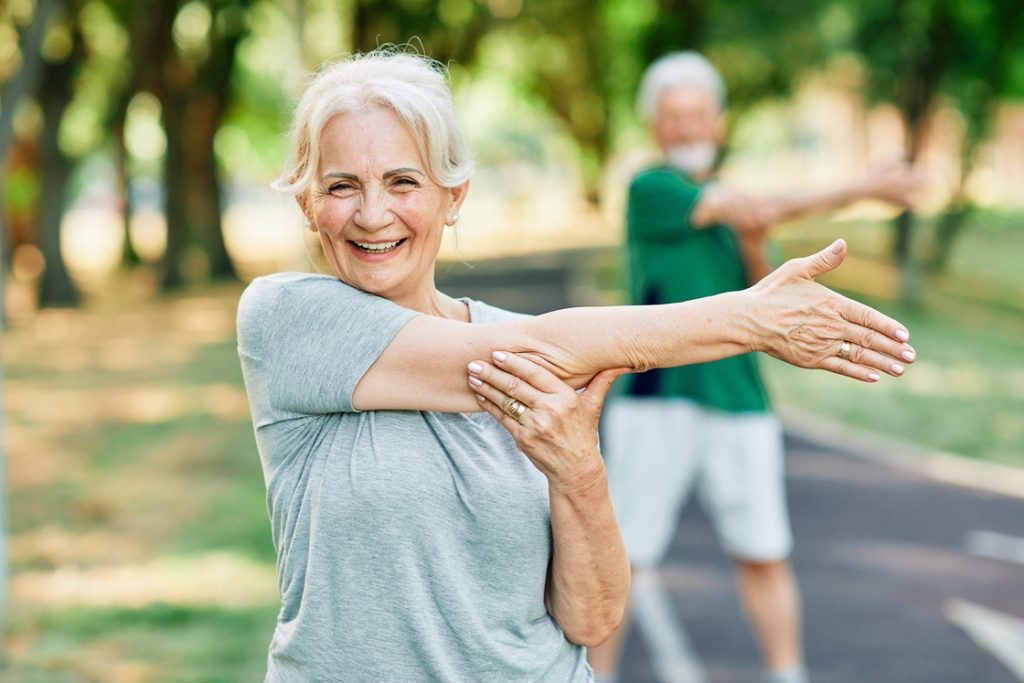 Woman working out in park while on vacation