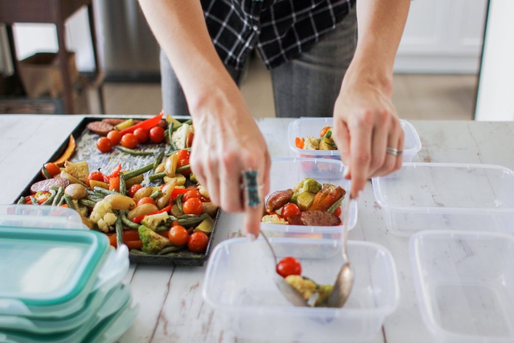 Woman using time reserved on weekend for meal prep