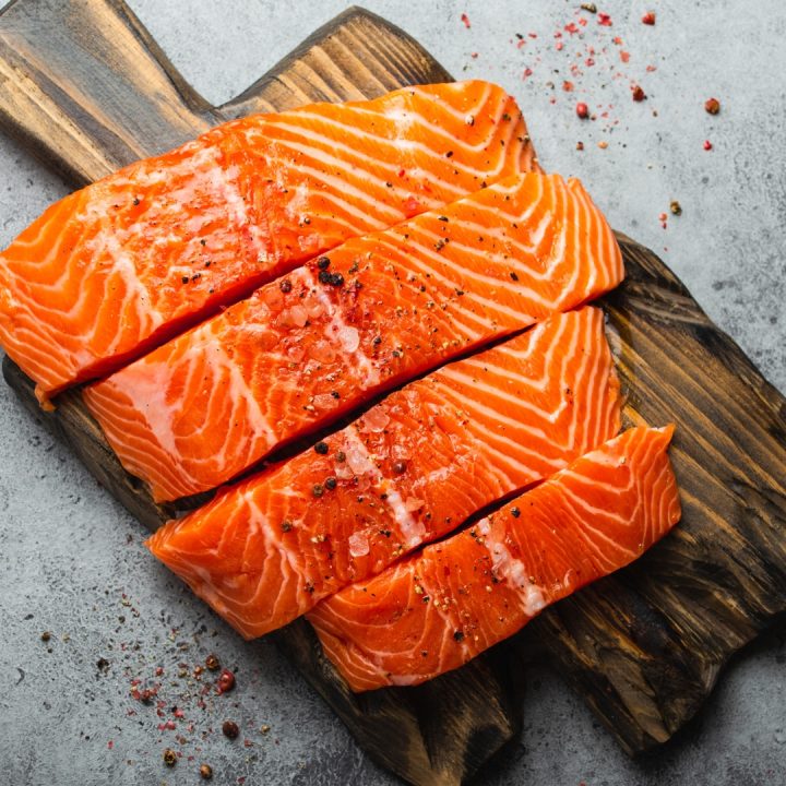 salmon fillet on wood board