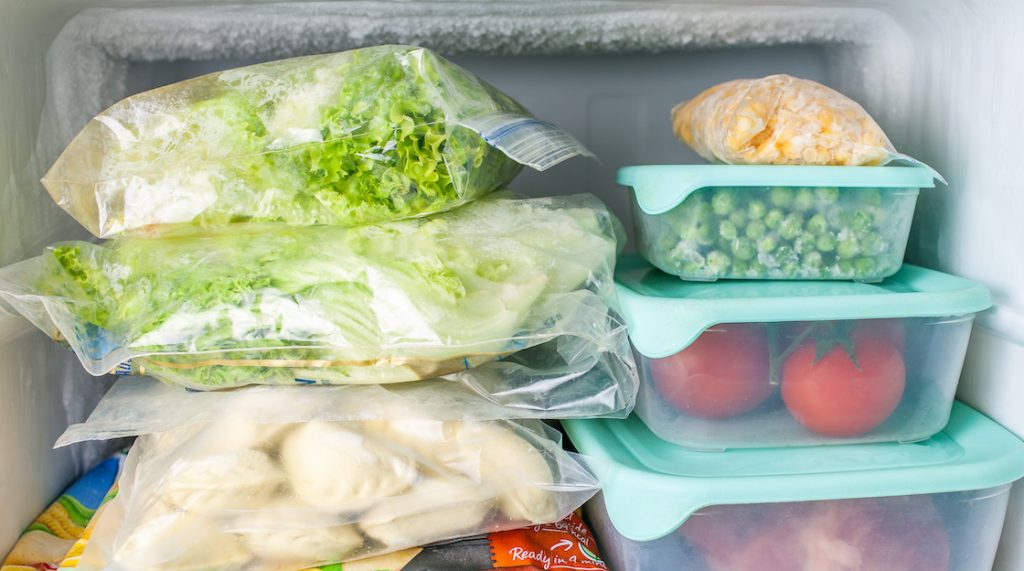 Multiple containers storing food in a freezer